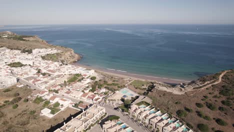 Aerial-of-waterfront-holiday-homes-in-Burgau,-Algarve,-Portugal