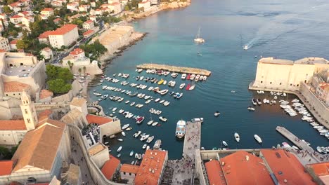 Aerial-view-over-Dubrovnik-Old-Town-during-sunset-on-the-coast-of-Adriatic-Sea,-Dalmatia,-Croatia---popular-travel-destination-UNESCO-World-Heritage-Sites-of-Croatia