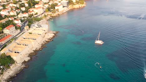 Aerial-shot-over-on-the-coast-of-Adriatic-Sea-in-Dubrovnik-Old-Town-during-sunset-,-Dalmatia,-Croatia---popular-travel-destination