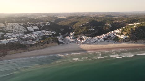 Landscape-aerial-of-Salema,-a-coastal-village-in-Algarve