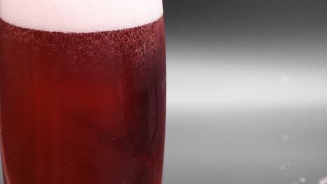 Pouring-Cherry-Cider-into-a-glass,-close-up-shot