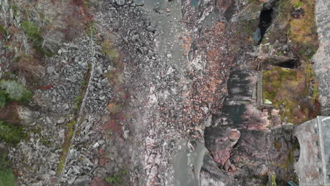 Aerial-top-down-drone-footage-flying-over-dried-out-Trollhättan-Waterfalls-revealing-rocky-bottom-waiting-for-the-locks-of-a-dam-to-be-reopen-with-pouring-water-in-Trollhattan-Sweden