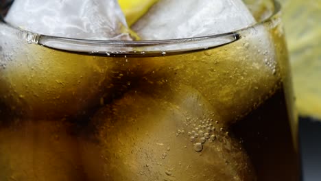 Ice-cold-Cola-drink,-in-a-glass-with-ice-cubes