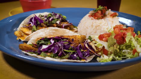 Fresh-marinated-fish-tacos-at-Mexican-restaurant,-slider-close-up-HD