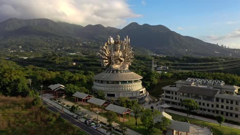 Aerial-flight-towards-guanyin-goddess-temple-with-silver-monument-in-taiwan