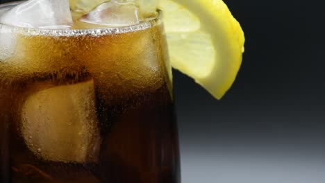 Full-Glass-of-Cola-with-ice-cubes-and-a-lemon-slice