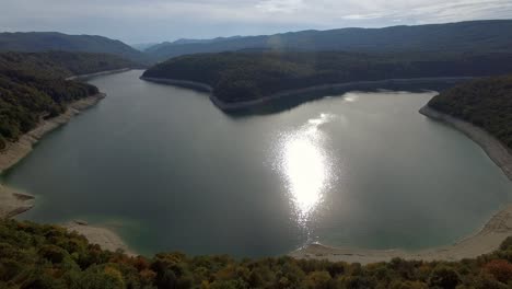 Aerial-view-of-Lac-vouglans-reservoir,-a-hydro-electric-power-station-lake-in-Haut-Jura,France