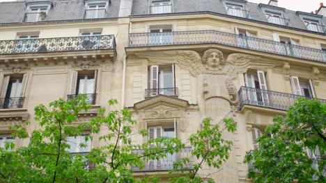 Haussmann-Style-Building-With-Unique-Caryatid-Angel-On-Exterior-Facade