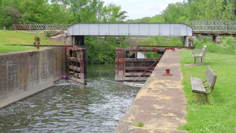 Water-flowing-through-in-Hennipen-Canal-,-locks-are-open-and-unused-since-1951