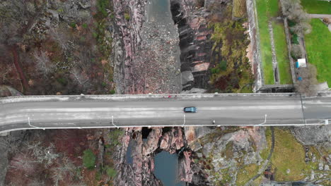 Aerial-bird-eye-view-of-vehicle-driving-on-Oskarsbron-Oskar-bridge-over-Trollhättan-Trollhattan-Waterfalls-Sweden