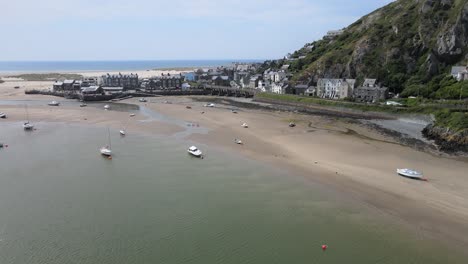 Barmouth-North-Wales,-UK-seaside-town-in-summer-aerial-footage