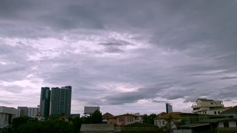 Time-Lapse-of-the-sky-moving-seeing-condominium-and-house-in-front-and-natural-daylight