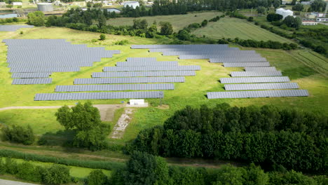 Aerial-View-Of-Solar-Panels-In-Photovoltaic-Power-Plant-Near-Gdansk,-Poland---drone-shot