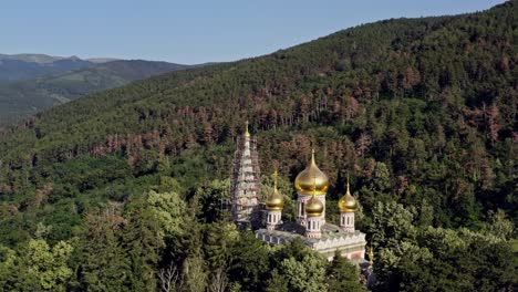 Beautiful-golden-domes-of-Shipka-memorial-church-Balkans-Bulgaria-on-blue-sky-morning-Aerial-shot