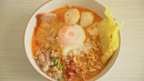 instant-noodles-with-pork-and-meatballs-in-spicy-soup-or-Tom-Yum-Noodles-in-Asian-style