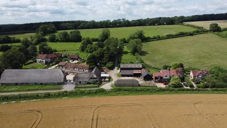A-high-angle-drone-shot-of-a-very-small-english-village-in-the-south-of-england,-this-video-was-shot-at-sunrise-on-a-bright-day-and-was-recorded-on-the-DJI-mavic-2-pro-at-FHD-1080p