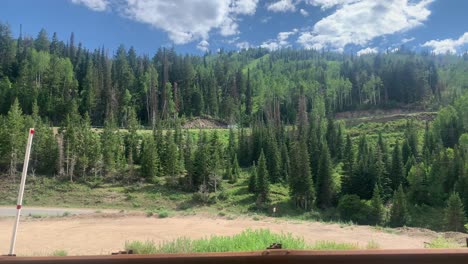 POV-view-from-a-car-driving-on-the-highway-70,-in-middle-of-Plumas-national-forest,-in-California