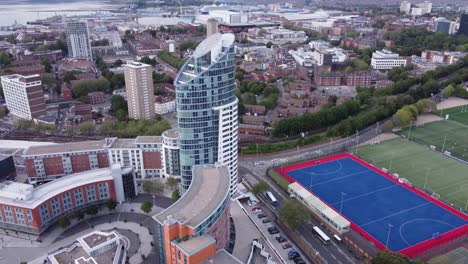 Aerial-View-Of-Apartment-Building-in-Portsmouth,-England-At-Daytime---drone-shot