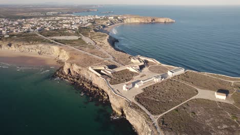 Aerial-perspective-of-the-colour-dynamic-ocean-with-Fortaleza-de-Sagres-fortress-in-the-centre