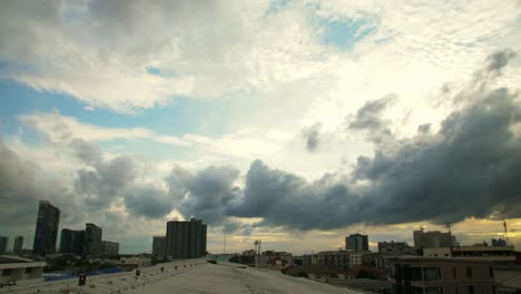 Silhouette-of-condominium-and-house-in-front-of-sky-cloud-moving-and-natural-daylight