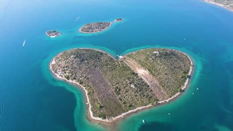 Aerial-view-of-the-beautiful-Galešnjak,-Island-of-Love,-Lover's-Island,-Otok-za-Zaljubljene,-Love-Island,-Heart-shaped-Island-in-the-Adriatic-Sea-in-Croatia