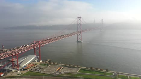 Wide-aerial-shot-25-de-Abril-bridge-in-Lisbon,-Portugal