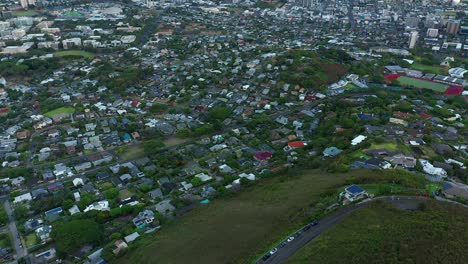 Panning-aerial-view-from-round-top-drive-to-Waikiki-on-the-Island-of-Oahu,-Hawaii