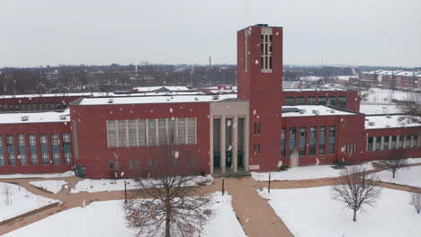 Front-entrance,-large-American-school,-college-building-during-winter