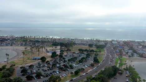 Aerial-flying-over-mission-bay-towards-Giant-Big-Dipper-roller-coaster,-California