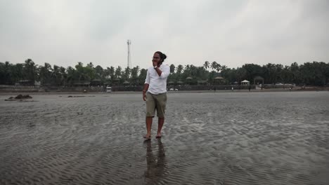 indian-long-hair-boy-walking-on-beach-gorai-india-vivekanand-ingle-follow-shot-