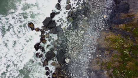 4K-30FPS-Aerial-Footage-Oregon-Coast---Waves-Crashing-Against-the-Rocky-Moss-Shore,-Turquoise-Blue-Water,-Foamy-Water,-Contrast--Top-Down-Shot-of-Pacific-Ocean-Shore-in-South-Oregon---DJI-Drone-Video
