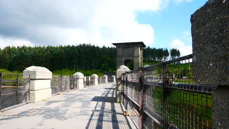 Sunny-Alwen-reservoir-concrete-landmark-rural-water-supply-historical-building-footpath-dolly-left