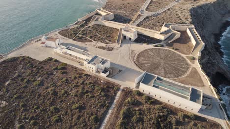 Aerial-circular-rotation-of-a-historical-fort-Fortaleza-de-Sagres-buttressed-fortress-in-Portugal