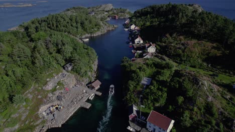 Drone-footage-of-boat-driving-between-islands,-5.2k
