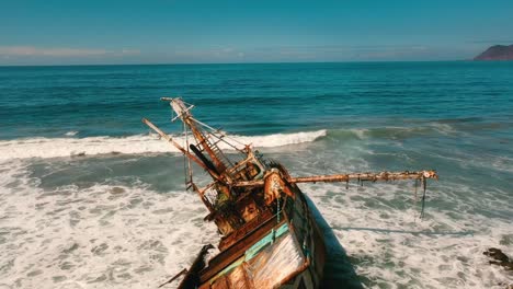Aerial-Shot-of-a-Sunken-Ship-in-the-Pacific-Ocean-in-the-Summer-on-a-Blue-Sky-Day