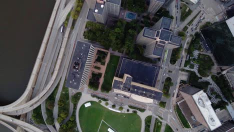 Aerial-view-over-buildings-in-downtown-Pittsburgh,-USA---rotating,-top-down,-drone-shot