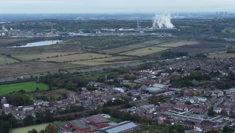 English-industry-urban-landscape-overlooking-motorway-and-power-station-aerial-rising-view