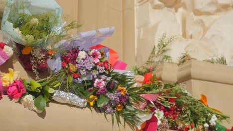 Flowers-on-the-wall-of-Cathedral-Basilica-of-Our-Lady-of-the-Pillar,-celebrating-the-Virgin-Mary-in-Zaragoza,-Spain---close-up-shot