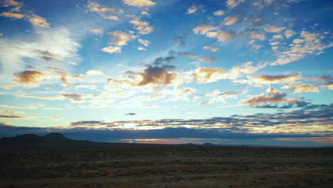Beautifully-colorful-morning-flight-over-the-Mojave-Desert's-arid-landscape---sliding-aerial-view