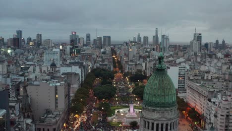 Aerial-at-dusk-around-the-dome-of-the-Palace-of-the-Argentine-National-Congress-at-Plaza-Congreso,-Buenos-Aires,-Argentina