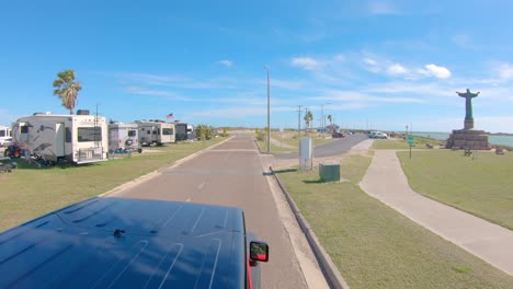 Point-of-View-from-vehicle-roof-top-while-driving-through-Isla-Blanca-Park-in-the-winter---South-Padre-Island,-Texas