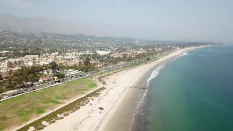 Aerial-flyover-Santa-Barbara-beach-front-with-clear-skies-and-blue-water