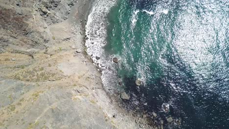 Blue-Pacific-Ocean-and-Rocky-Cliffs.-Aerial-ascending