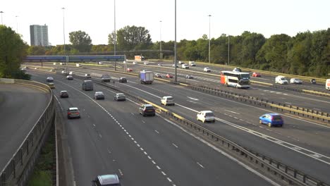 Vehicles-driving-on-a-motorway-on-highway-M8-of-the-ring-of-Glasgow-on-a-bright-summer-day