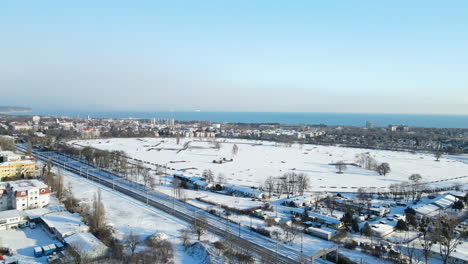 Sports-Field-Full-Of-Snow-Next-To-The-Highway-In-Gdansk,-Poland