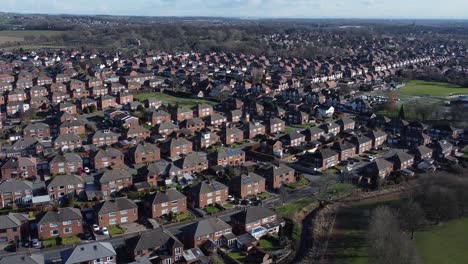 Typical-Suburban-village-residential-neighbourhood-Kent-homes-rooftops-aerial-view-descending