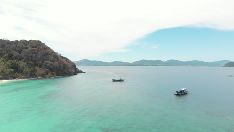 Clean-crystal-waters-of-Phuket-against-mountains