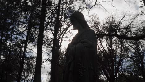 Silhouetted-Statue-of-Jesus-Christ-in-the-Forest