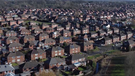 Suburban-Neighbourhood-residential-Birmingham-homes-rooftops-real-estate-property-aerial-slow-rising-tilt-down-view