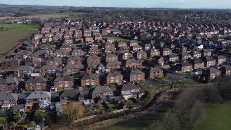 Typical-Suburban-village-residential-neighbourhood-Liverpool-property-rooftops-aerial-view-push-in-right